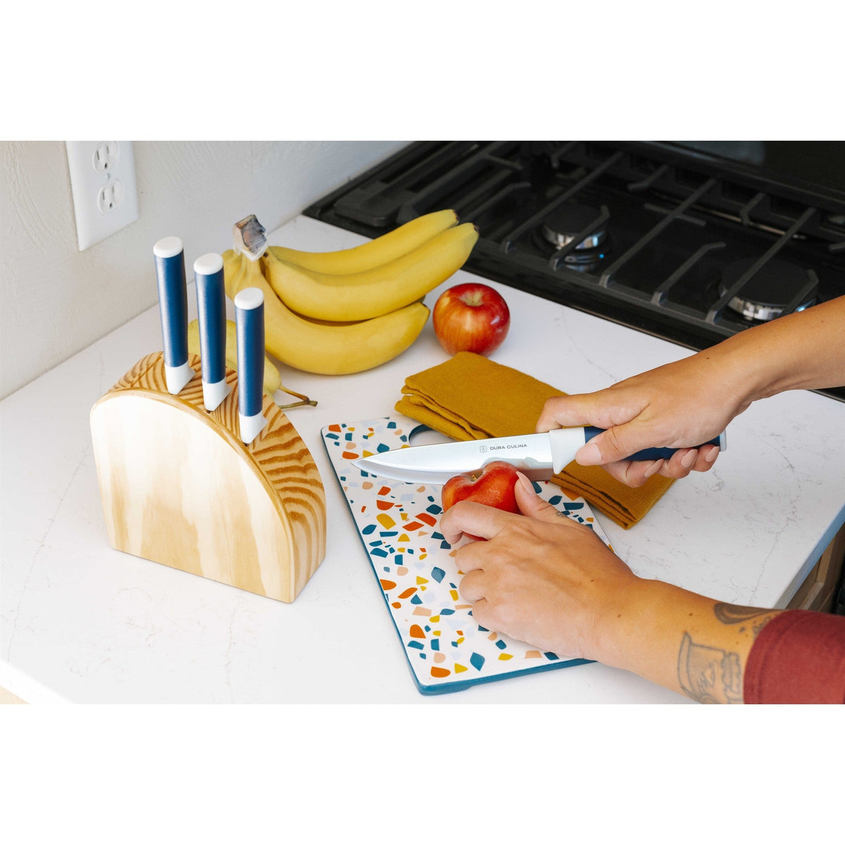 Dura Living DUO-GRIP 5-piece kitchen knife starter set with stainless steel blades and ergonomic handles on a wooden surface.
