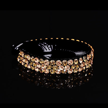 Rhinestone hair claw clip with sparkling crystal accents and secure claw-style grip