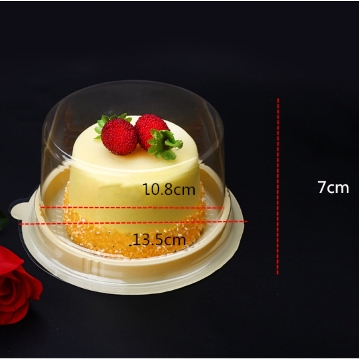 Transparent round blister cake packaging box for desserts, shown empty from an angled view