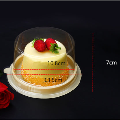 Transparent round blister cake packaging box for desserts, shown empty from an angled view