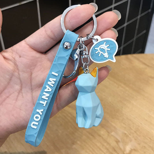 Cute dinosaur keychain key ring, colorful novelty accessory displayed against a plain background