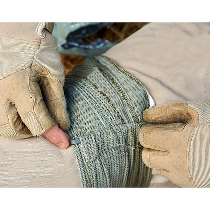 Portable outdoor training hemostatic bandage kit package and components displayed on a plain background