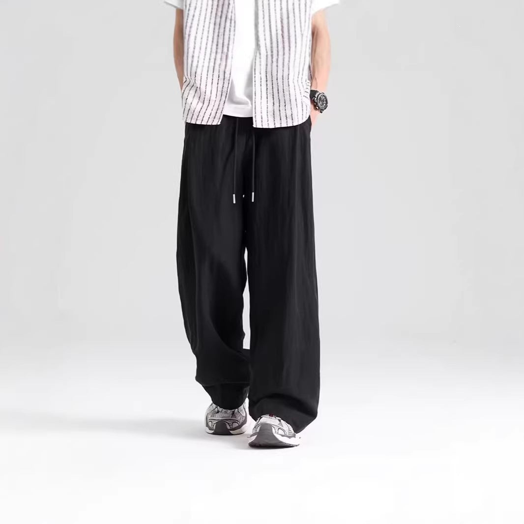 Men's draped breathable ice silk athletic pants in a relaxed fit and lightweight fabric
