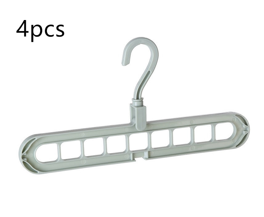 Plastic clothes hanger with storage hook for hanging garments