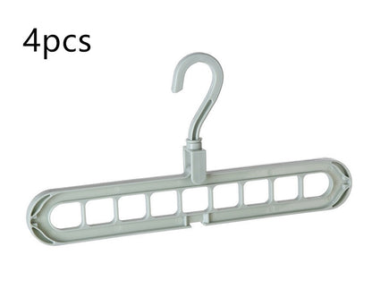 Plastic clothes hanger with storage hook for hanging garments