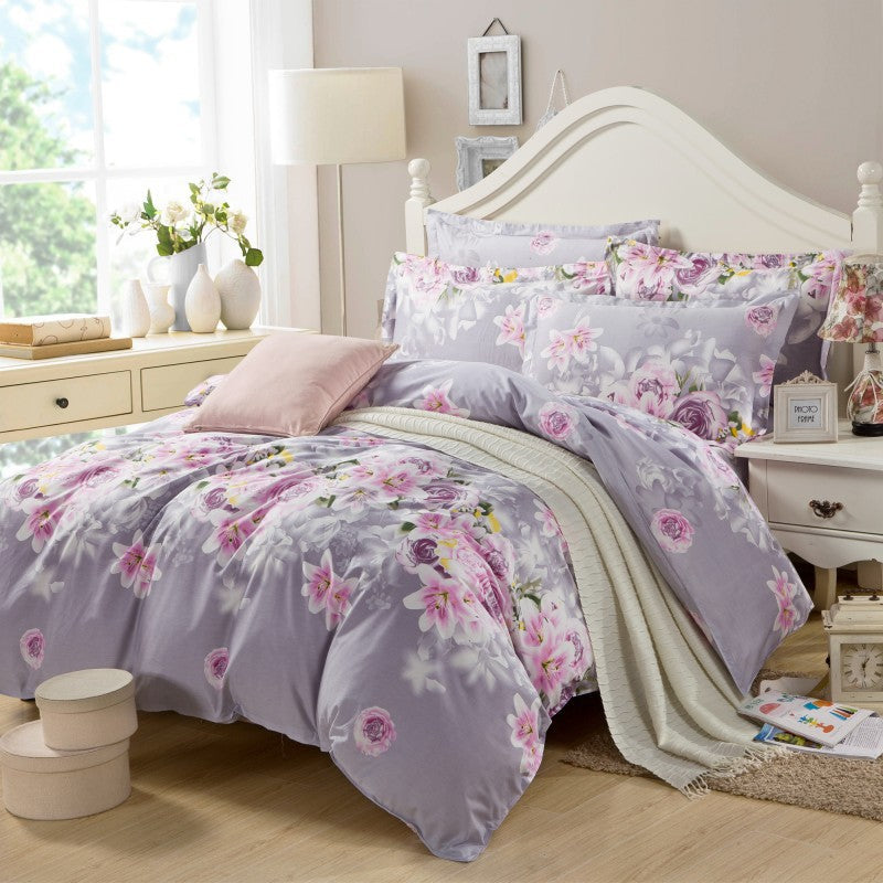 Four-piece cotton bedding set in soft home textile fabric, featuring a coordinated duvet cover and pillowcases