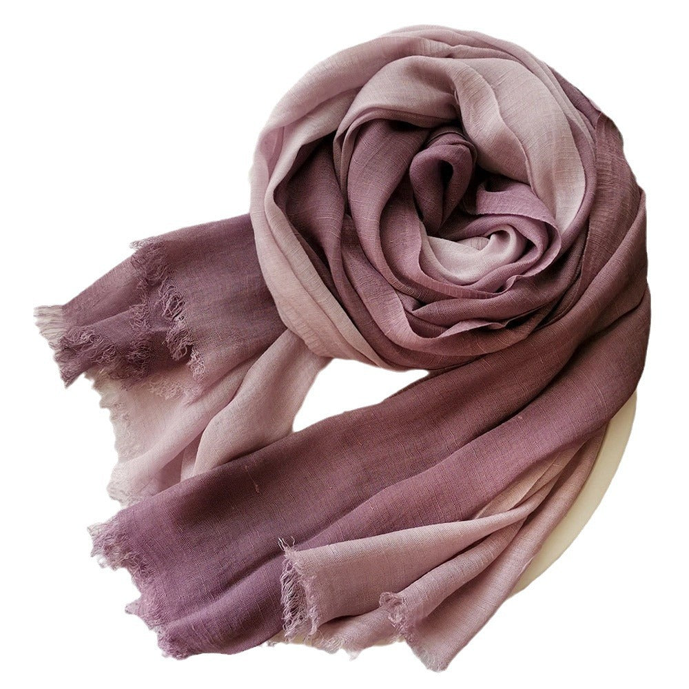Large soft warm cotton scarf with tassel trim, folded to show its textured fabric