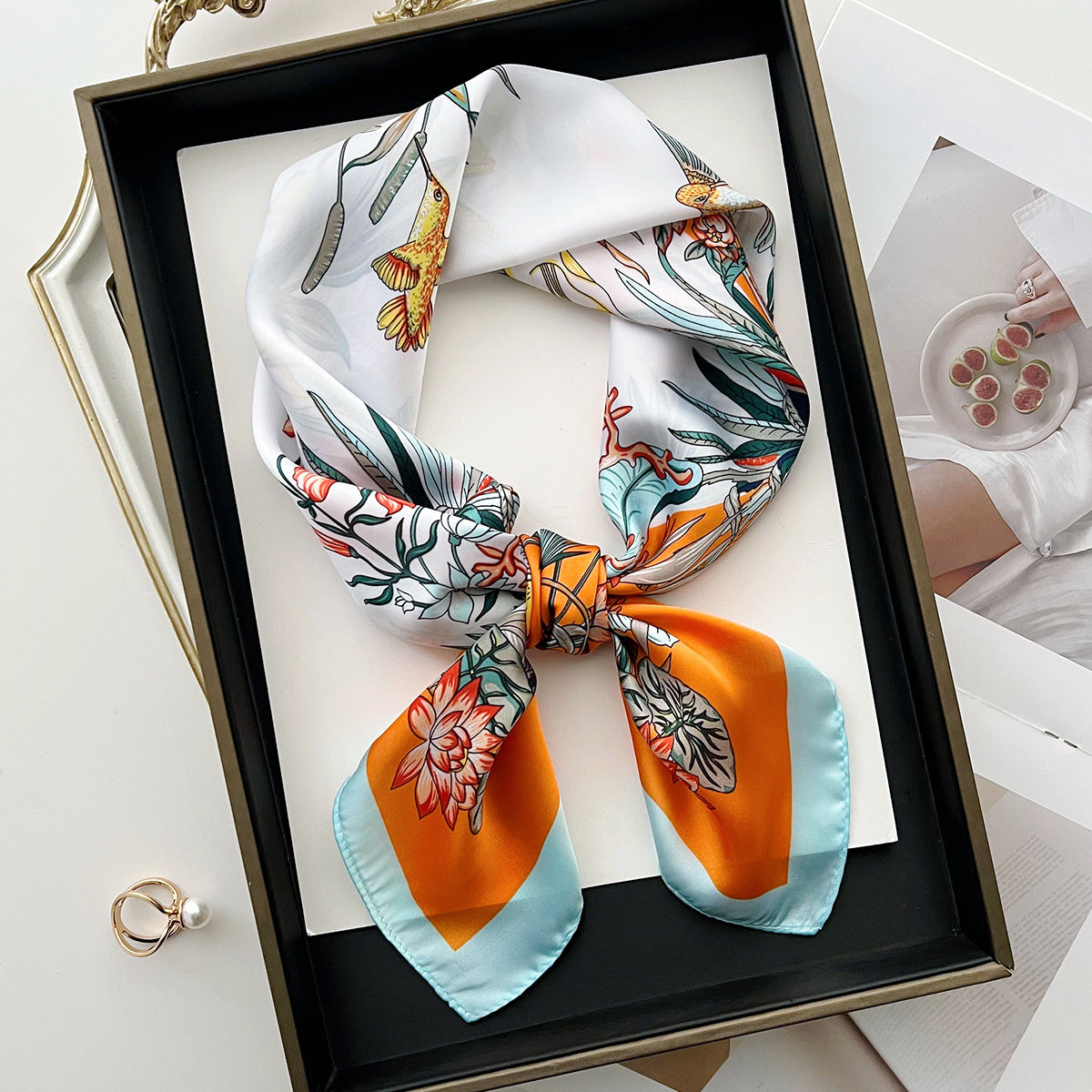 Sun-protective beach floral silk scarf with a colorful botanical pattern ensconced in lightweight fabric