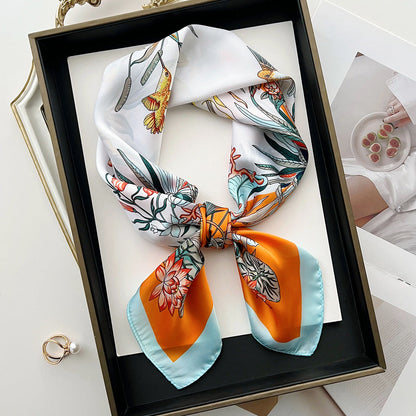 Sun-protective beach floral silk scarf with a colorful botanical pattern ensconced in lightweight fabric