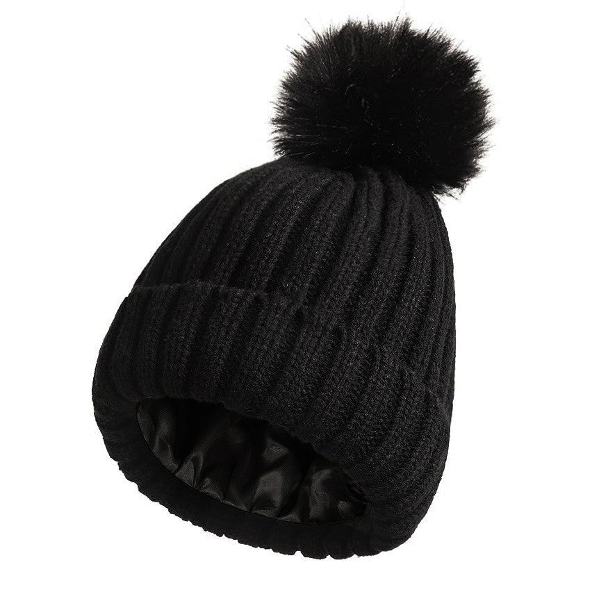 Women's solid-color brimmed hat with satin pom-pom detail