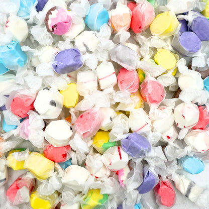 Assorted Salt Water Taffy Candy from Candy In Bulk in a large variety pack, featuring colorful chewy candies in different flavors.