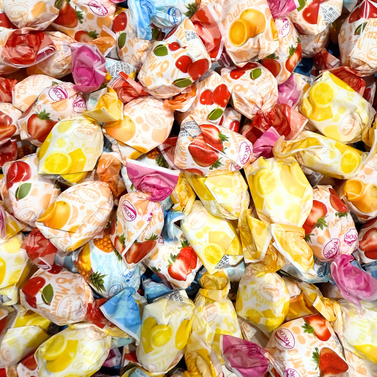 Assorted fruit-filled hard candies from Candy In Bulk in a large bulk bag, colorful and individually wrapped.