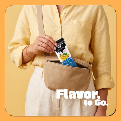 Four Syruvia sugar-free banana syrup pouches with bright yellow and green packaging, ideal for flavoring beverages and desserts.