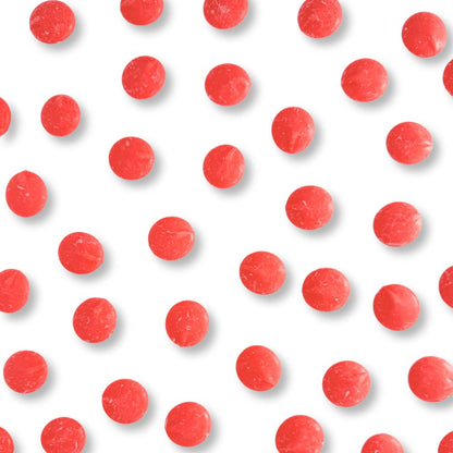 Red vanilla-flavored candy coating and melting wafers from Candy In Bulk, ideal for chocolate decorating and coating desserts.