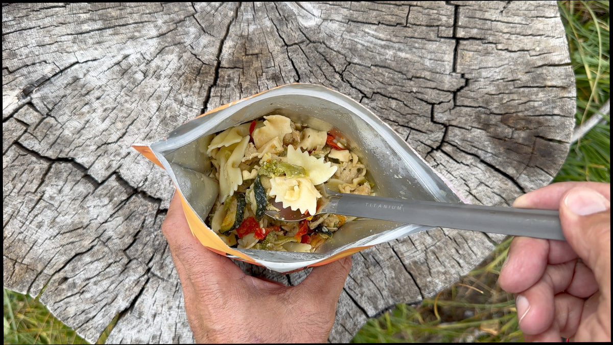 Rehydrated Chicken Pasta Primavera meal by FOUNDATION Outdoors, showcasing pasta, chicken pieces, and vegetable ingredients.