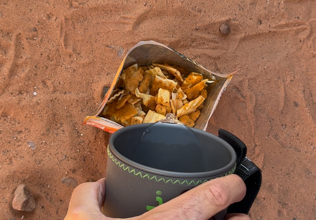 Foundation Outdoors lasagna meal in a dry packaging, ready to cook, showcasing a layered pasta dish with cheese and sauce.