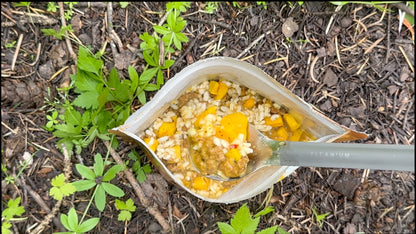 Rehydrated Spicy Italian Pork Sausage Risotto meal by FOUNDATION Outdoors, showing creamy risotto with sausage pieces and herbs.