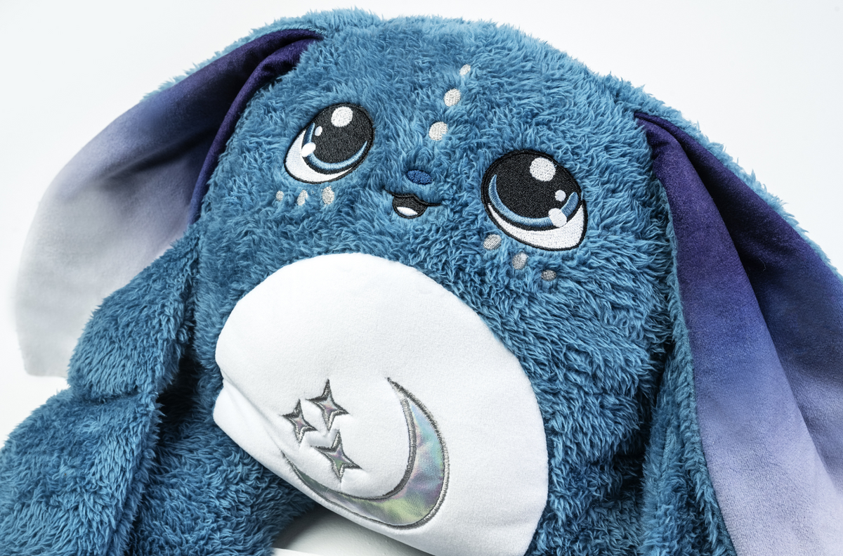 Moon Pals Orion 5lb Hugger Plush toy, soft plush character with detailed facial features and starry design for cuddling.