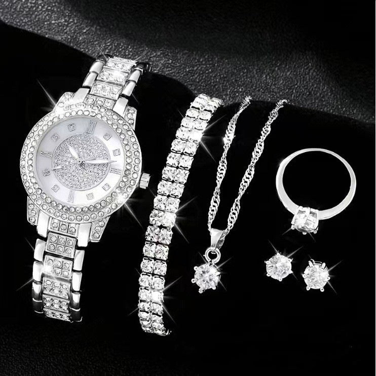 Women's Cornucopia diamond-embedded watch set with coordinating accessories, viewed on a clean background
