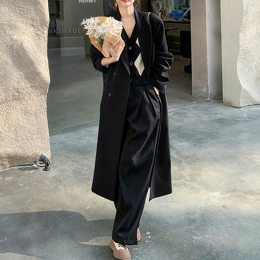 Women's long classic trench coat in British style, elegant spring outerwear with belted waist and button front