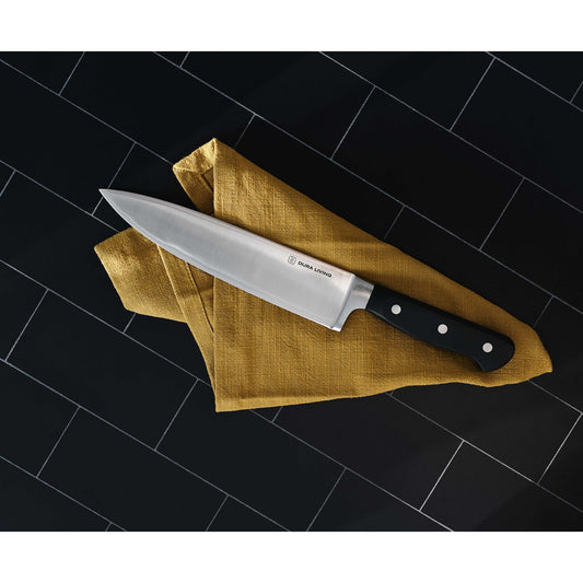 Dura Living Superior 4-Piece Kitchen Knife Set with black handles and stainless steel blades, arranged on a wooden surface.