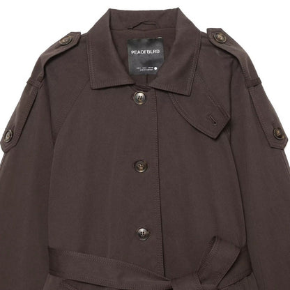 Elegant belted twill-textured trench coat with double-breasted front and structured lapels