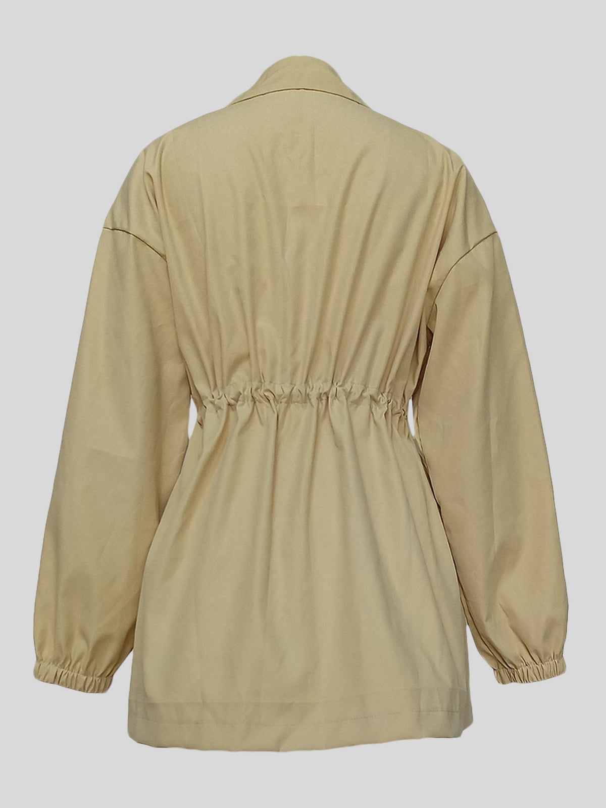 Women's drawstring waist mid-length trench coat in a classic tailored style