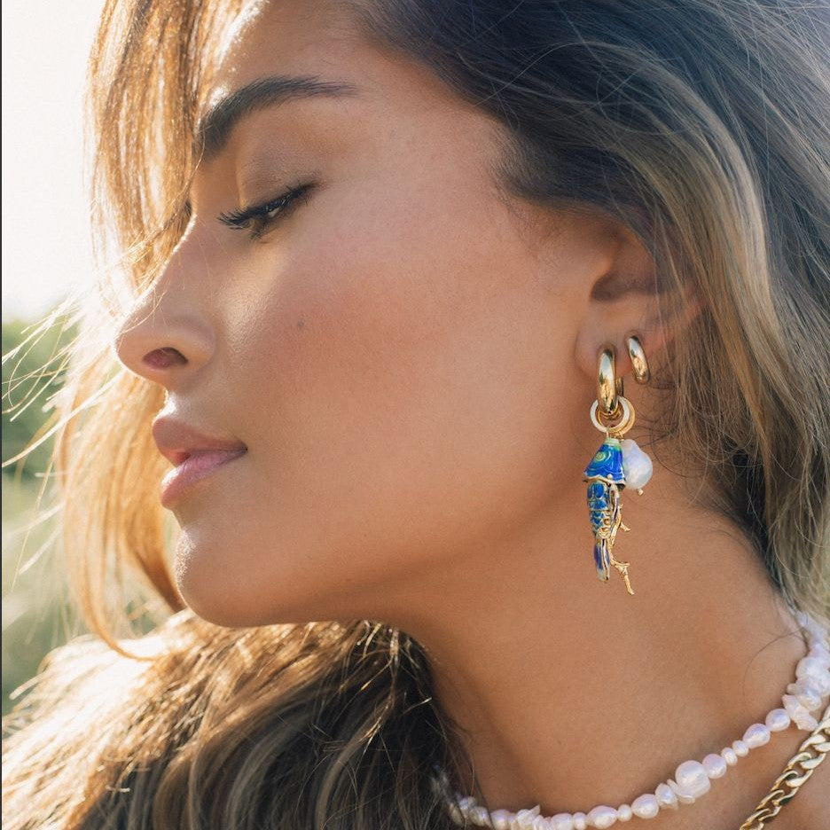 Coral small fish and conch shell earrings, fashionable seaside-inspired jewelry close-up