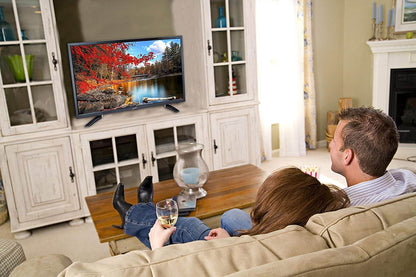 Supersonic 24-inch LED HDTV with widescreen display, USB, SD card reader, and HDMI ports, showing the television screen and controls.