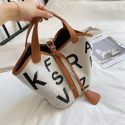 Women's letter printed canvas tote bag by BACKUPMYFILESNOW® featuring a stylish design and spacious interior for everyday use.