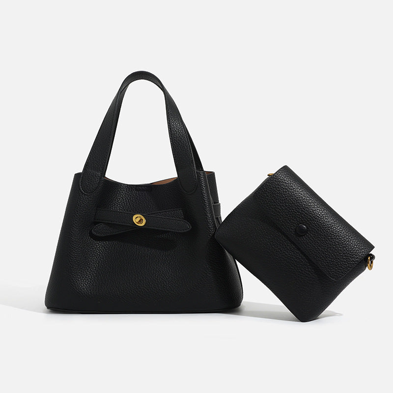 Fashionable bucket bag with cross-body strap, structured silhouette and adjustable shoulder carry design