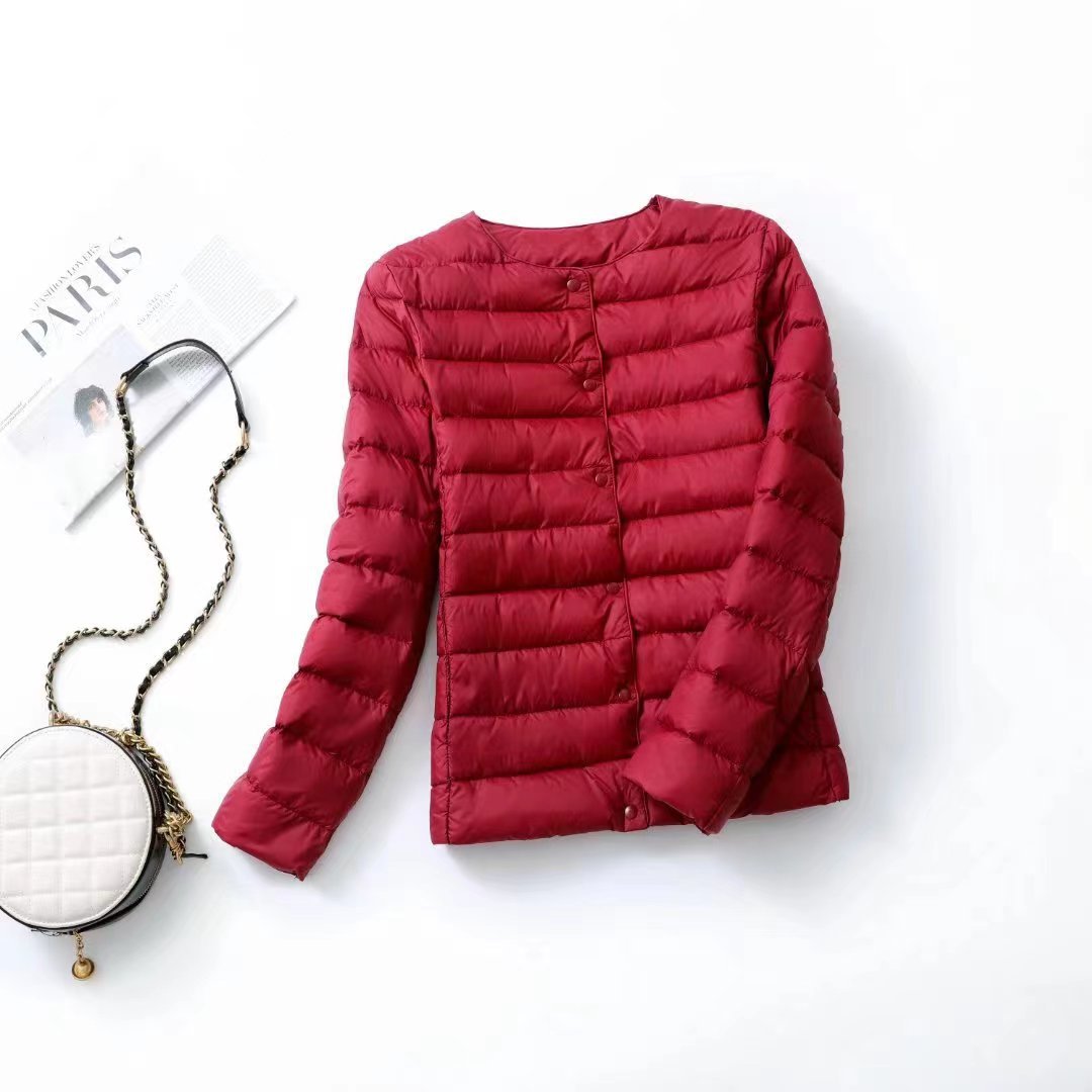 Women's lightweight white duck down jacket with quilted design and full-length sleeves