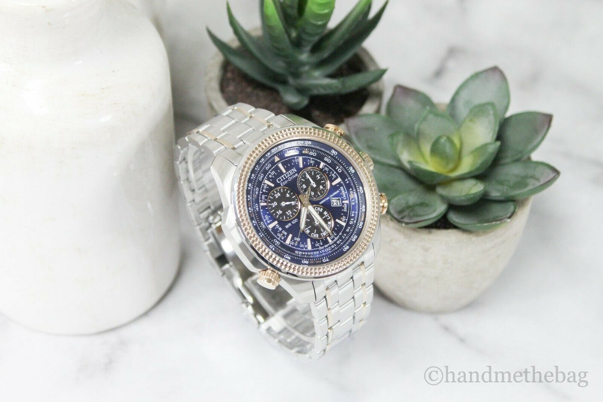 Citizen Eco Drive men's chronograph watch with two-tone stainless steel band and black dial featuring multiple subdials.