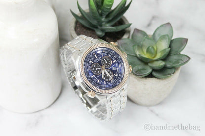 Citizen Eco Drive men's chronograph watch with two-tone stainless steel band and black dial featuring multiple subdials.