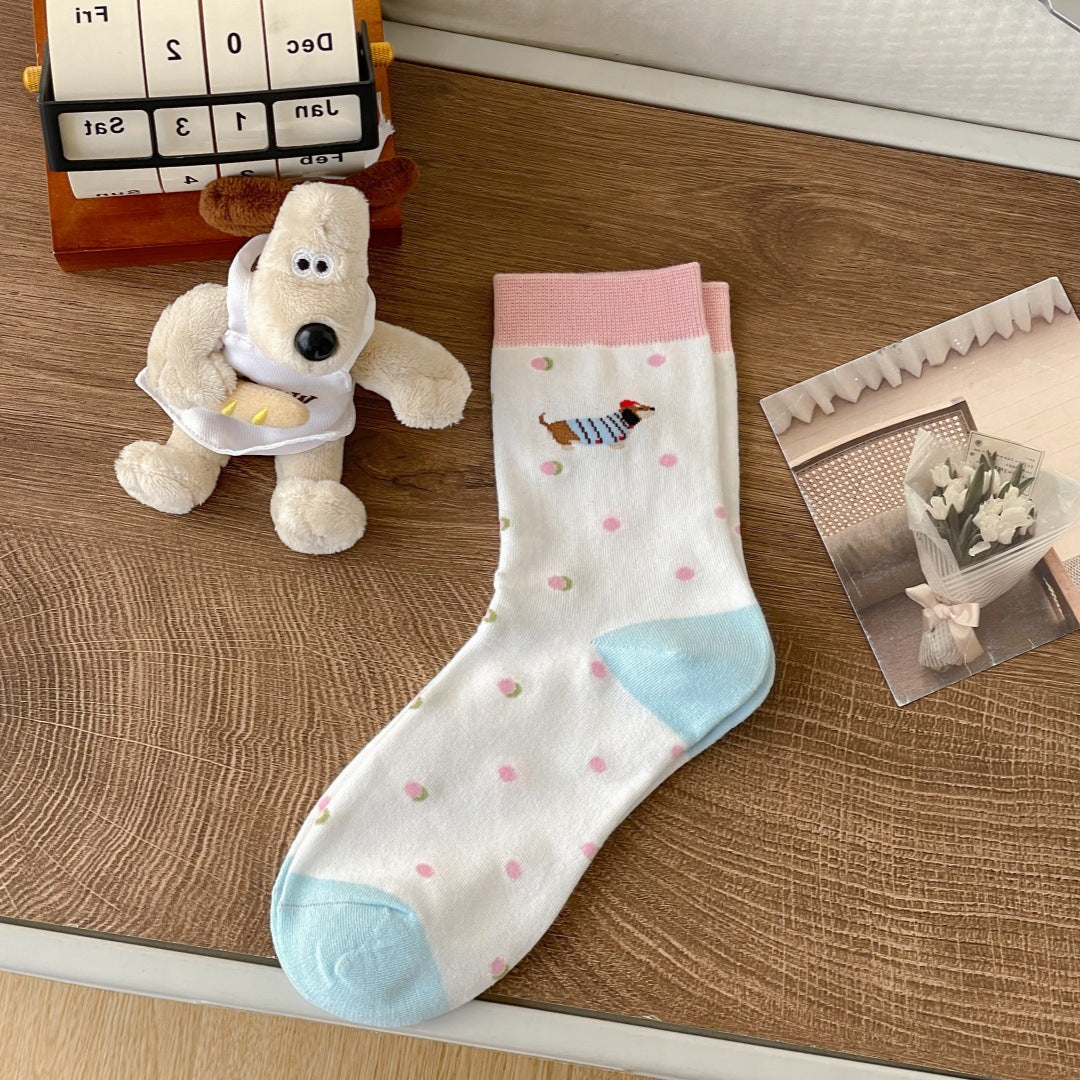Women’s cartoon dachshund socks featuring playful dog designs on a colorful background