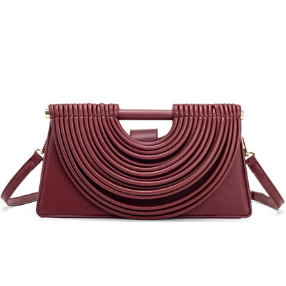 Handcrafted knotted woven noodle-shaped tote bag with textured design and structured handles