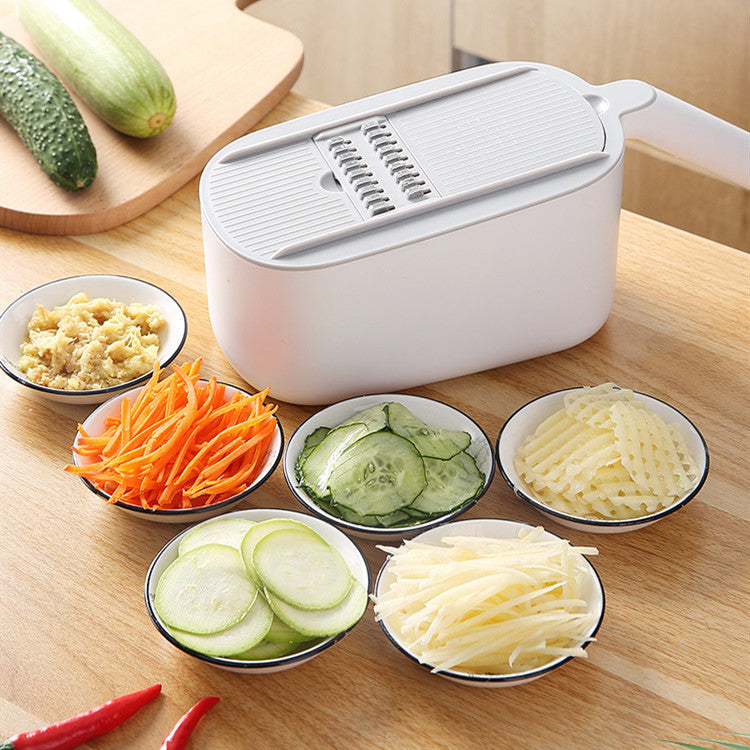 Kitchen vegetable slicer by My Store, compact handheld design for slicing vegetables