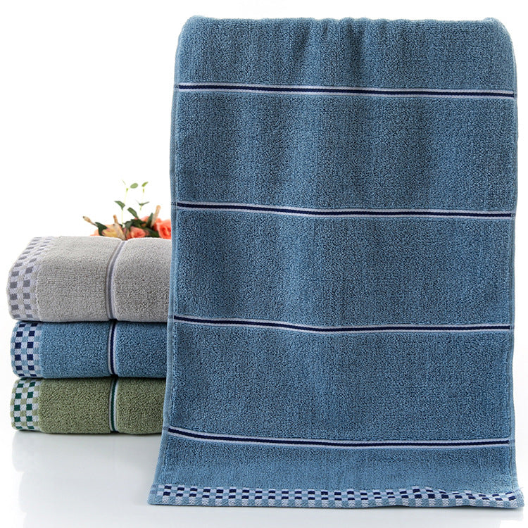 Cotton embroidered towel with detailed stitched design, displayed flat for a clear view