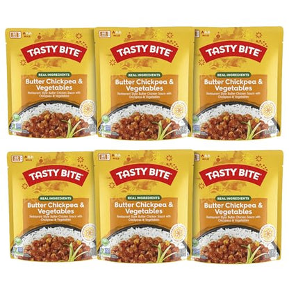 Microwaveable BACKUPMYFILESNOW® Indian Bombay Potatoes ready-to-eat entree in 10 oz pack, with steaming potatoes and spices.