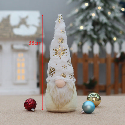 Faceless doll Christmas decorations in festive holiday attire displayed together