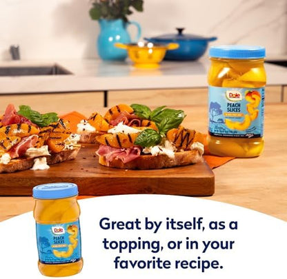 Canned Dole sliced peaches in a jar, 23.5 oz, 8-pack, showing golden peach slices in syrup inside clear jars