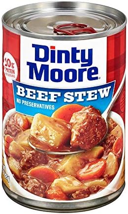 Canned Dinty Moore beef stew with potatoes and carrots in a 15oz can, ready for serving in a typical meal setting.