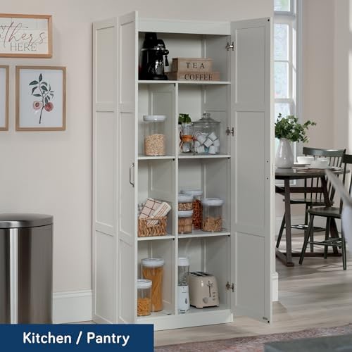 Sauder Select white storage cabinet or pantry with shelves, ideal for organizing snacks and kitchen essentials.