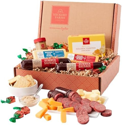 Hickory Farms farmhouse meat and cheese gift basket with summer sausage, gourmet cheeses, and snacks in a small box set.