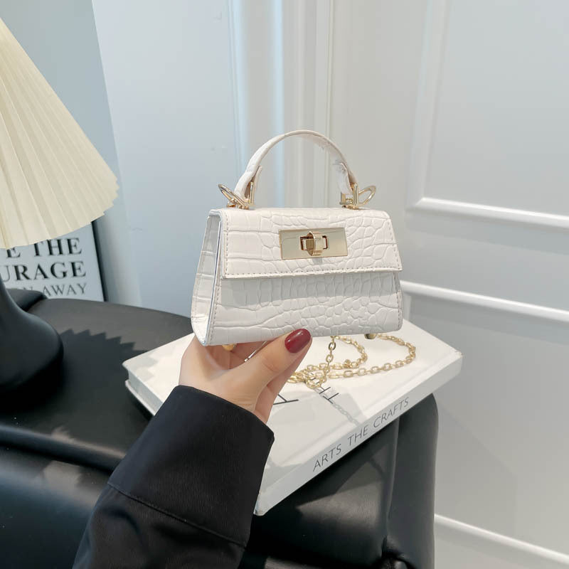 Casual small square handbag with shoulder strap in a compact, versatile design