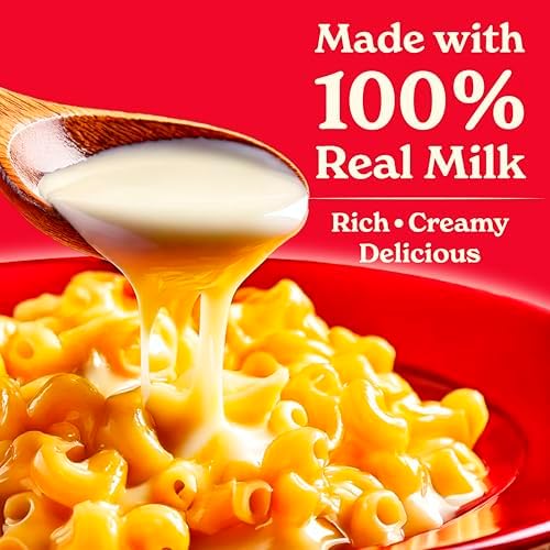 Eight cans of Carnation lactose-free evaporated milk shown in a pack, suitable for lactose intolerant baking and cooking.