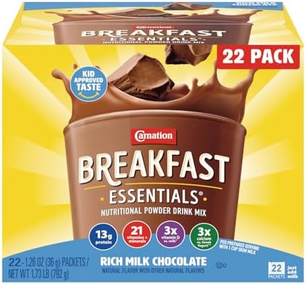 Carnation Breakfast Essentials Original nutritional powder drink mix in a glass, showing the ready-to-drink beverage.