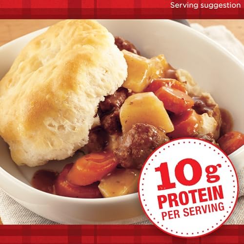 Canned Dinty Moore Beef Stew with potatoes and carrots in a 15oz can, ready to serve, displayed on a plain background.