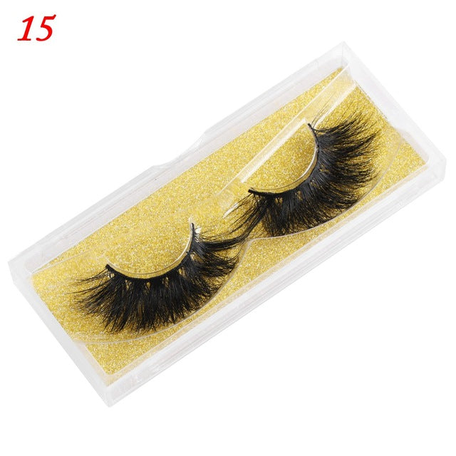 25mm wispy fluffy mink eyelashes, false lashes with soft layered texture folded on white background