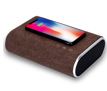 Wireless charger speaker with compact modern design and wireless charging pad
